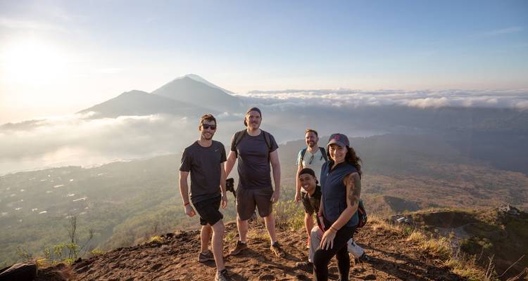 Group of travelers on a hilltop viewpoint